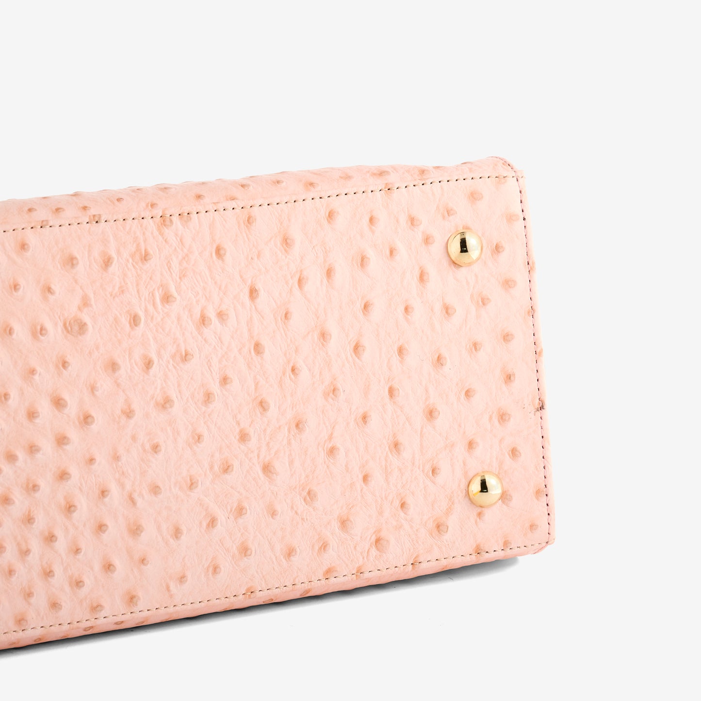 Courante Large Carryall in Ostrich Pink Main Leather Champagne Stripe Leather Handle Gold Hardware Bottom Bag Feet