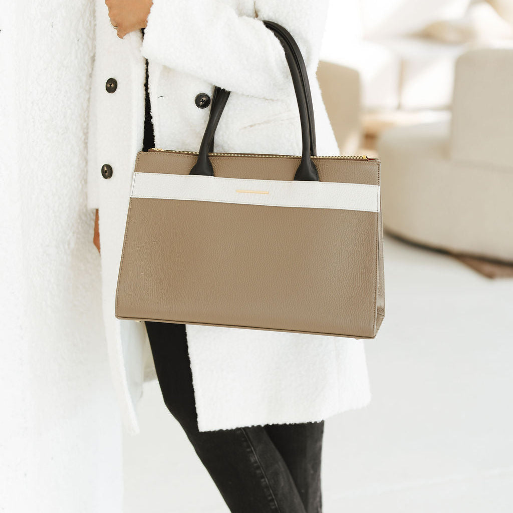 Courante Large Carryall in Taupe/Savanna Stone/Black model holding bag