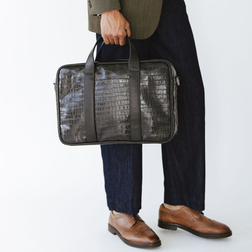 Mosso Briefcase in Croco Black/Black Model Holding Handle
