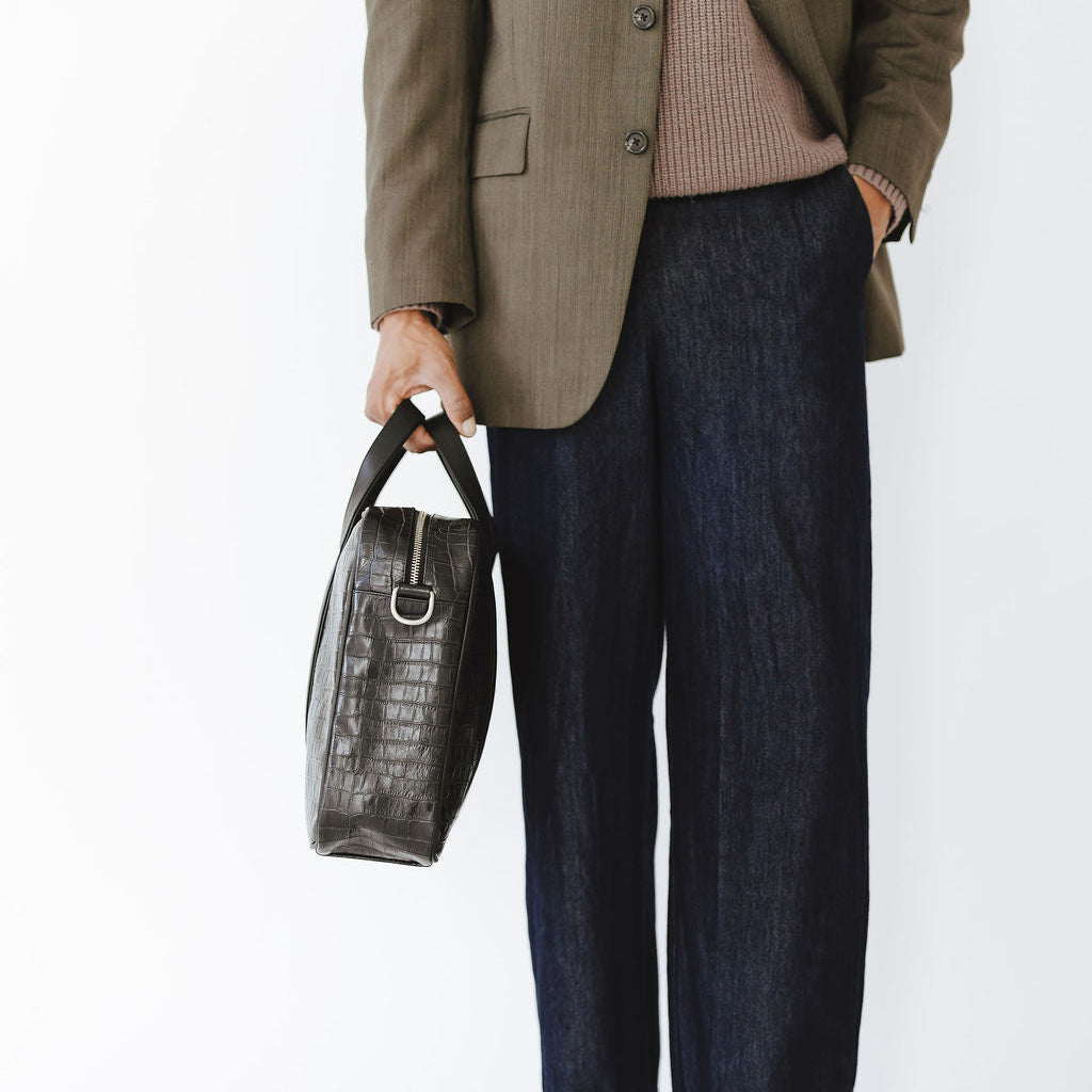 Mosso Briefcase in Croco Black/Black Model Holding Side Profile