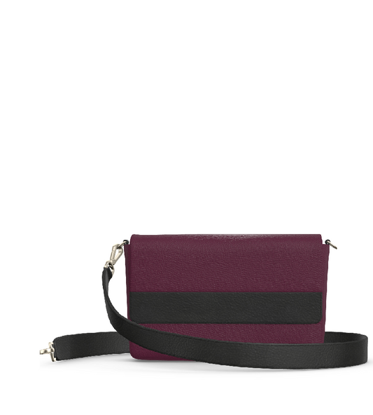 woman holding laudi vidni prima crossbody in embossed snake shadow and espresso leathers