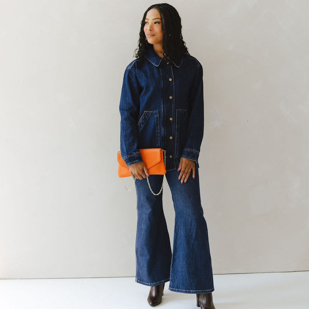 Comodo Envelope Clutch in Pebble Orange Model Holding