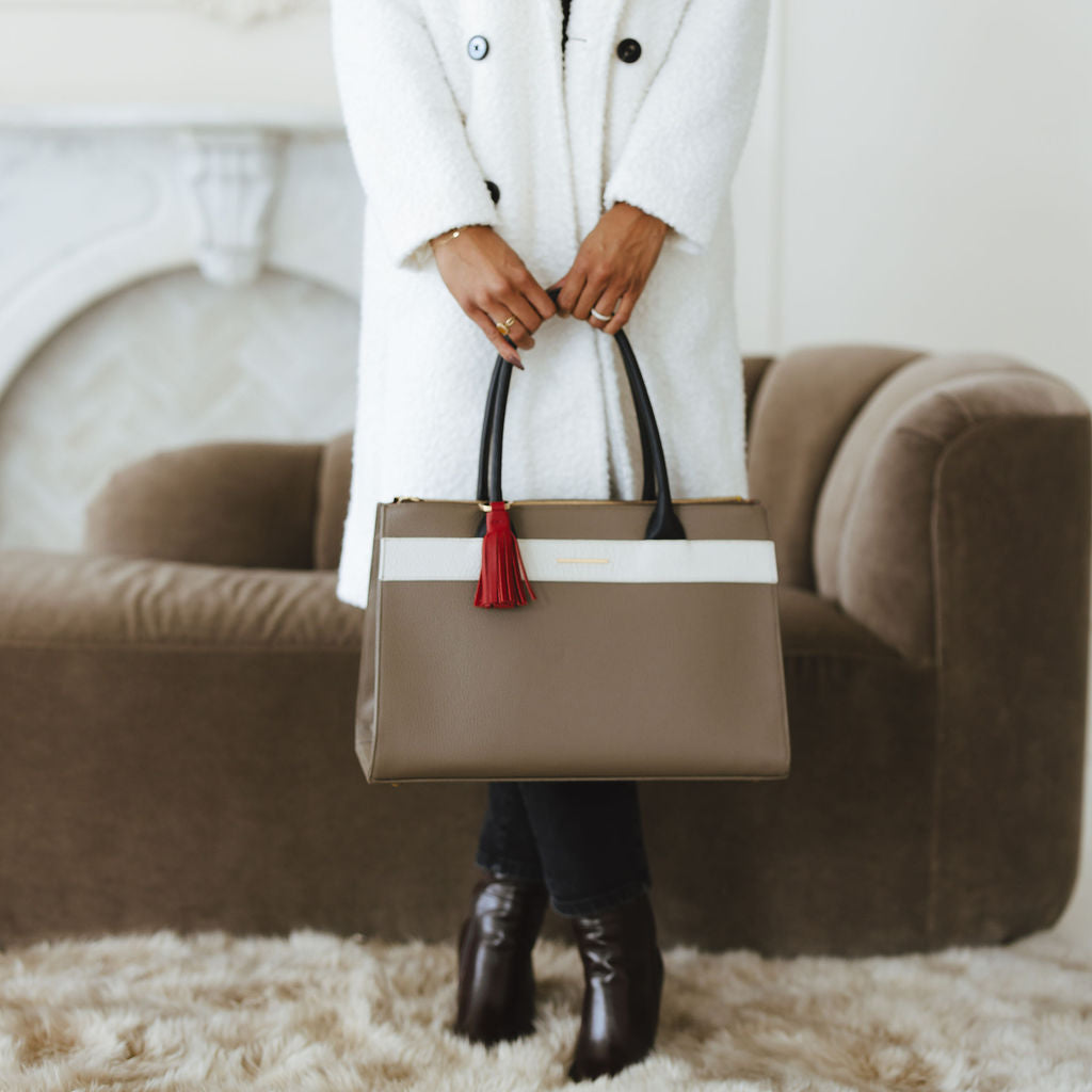 Courante Large Carryall in Taupe/Savanna Stone/Black with Tassel Model Holding