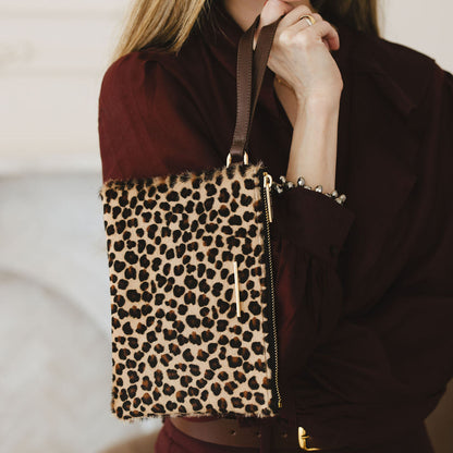 Grace Wristlet in Leopard/Espresso model holding