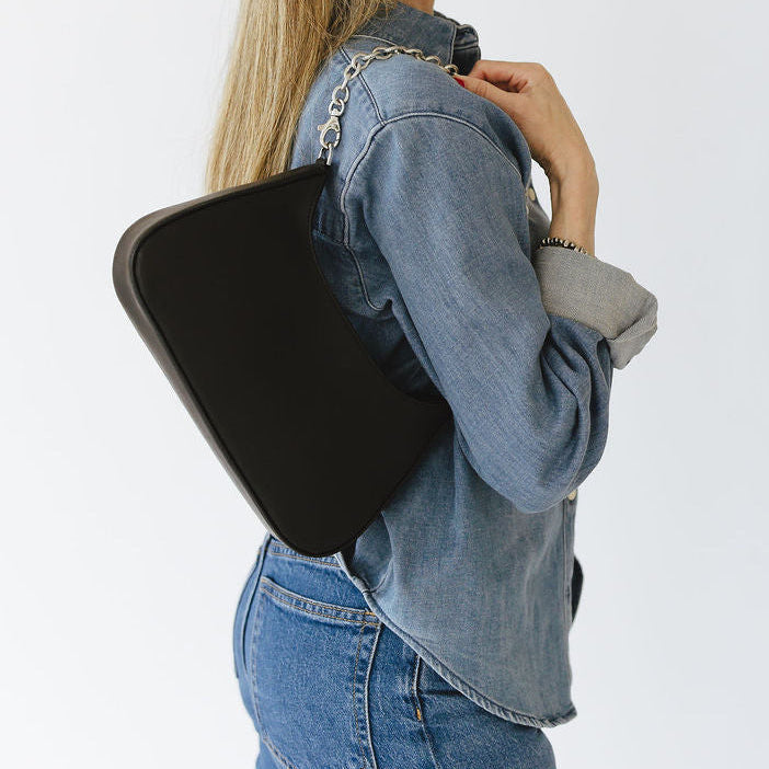 Harmony Shuolder Bag with Chain in Smooth Black with Silver Hardware on Model's Shoulder