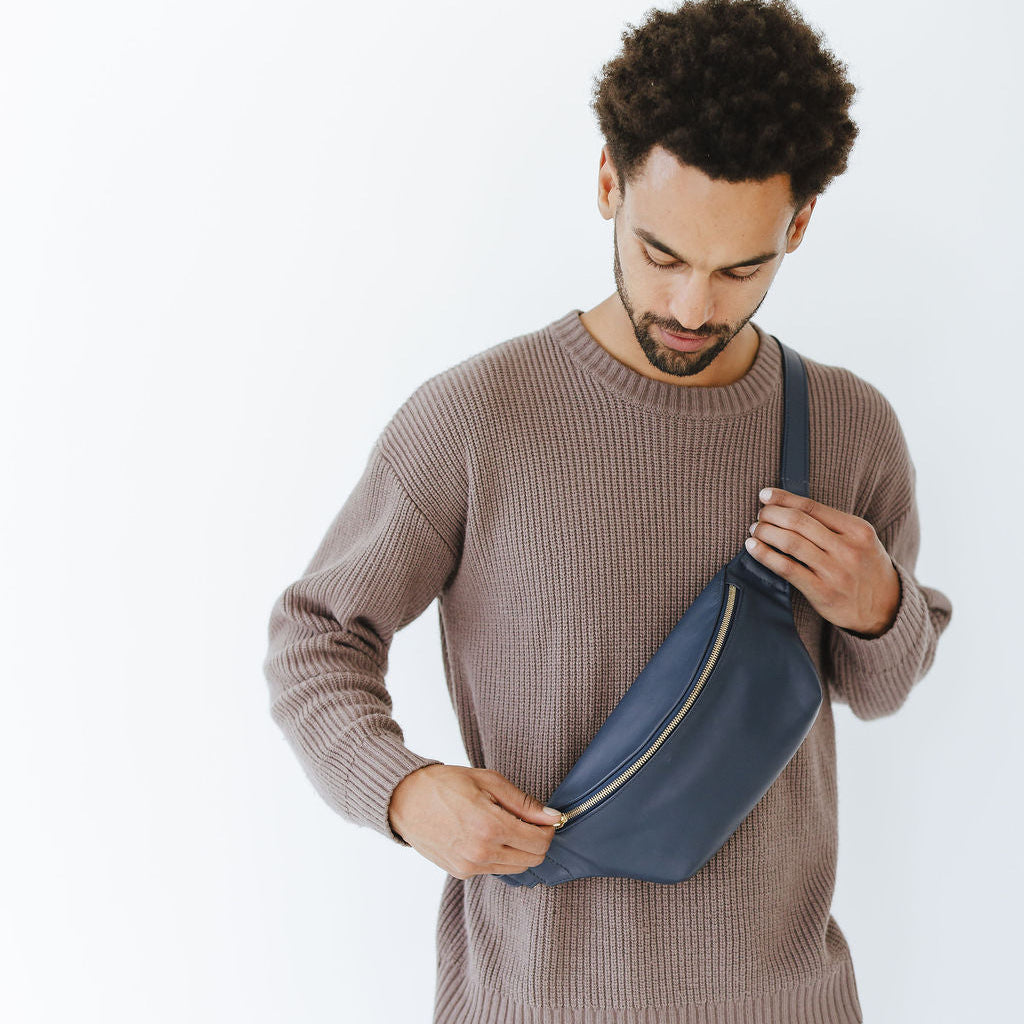 New Belt Bag in Indigo Leather on Model opening zipper