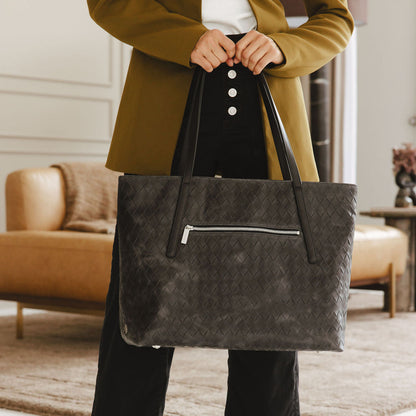 Opus Large Tote Bag in Basketweave Black Model Holding Straps