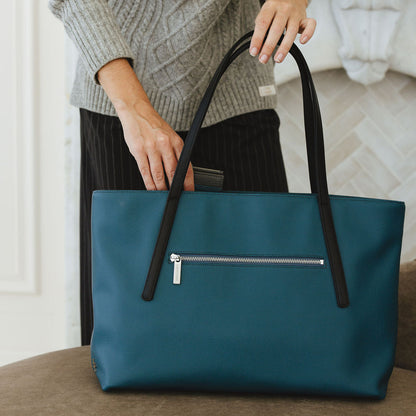 Opus Medium Tote in Peacock/Black on chair with wallet