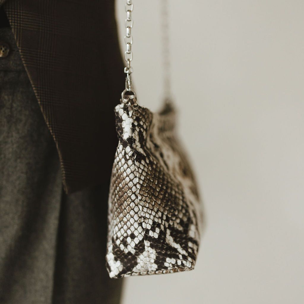 Vivace Crossbody with Chain in Embossed Snake Shadow Side View on Model