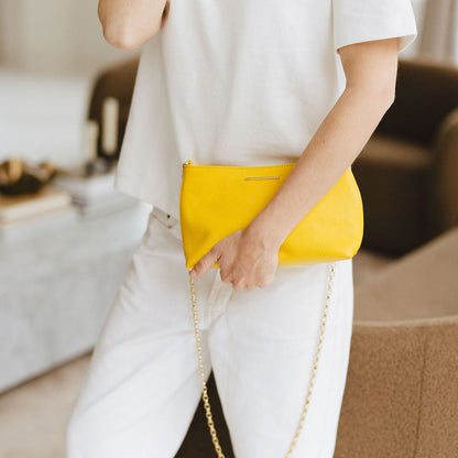 Vivace Crossbody with Chain in Yellow Model Hodling