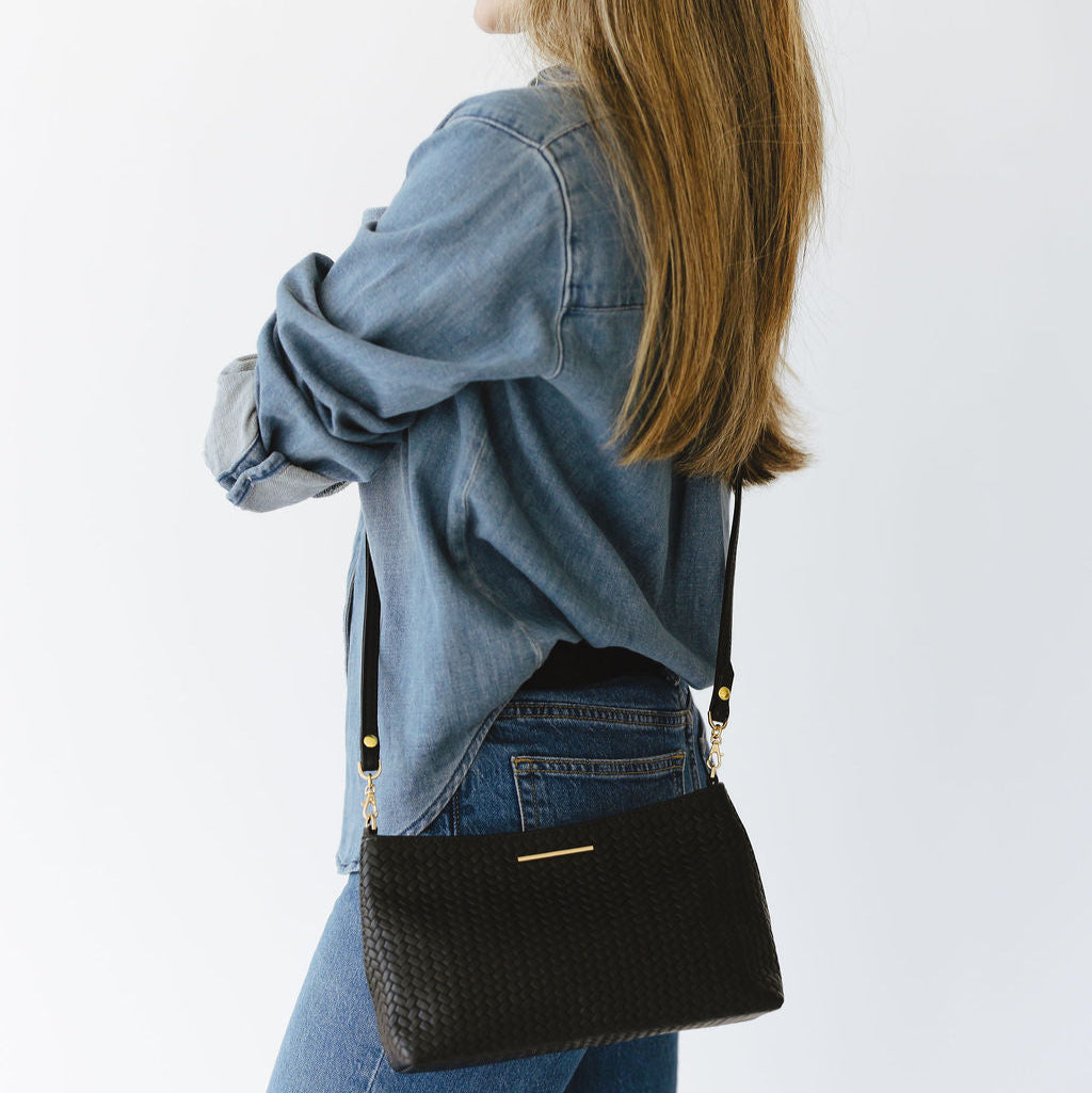 Vivace Crossbody with Leather Strap in Woven Texture and Smooth Black on Model Side