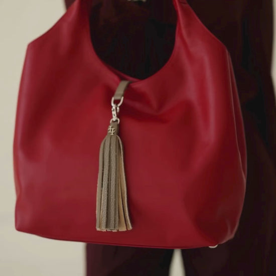 Model Swinging Largo Shoulder Bag in Cayenne and Espresso